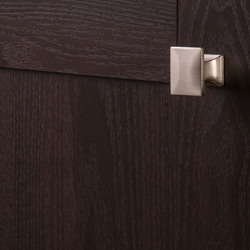 Satin nickel square cabinet knob mounted on dark wood cabinet in furniture hardware and home improvement collections