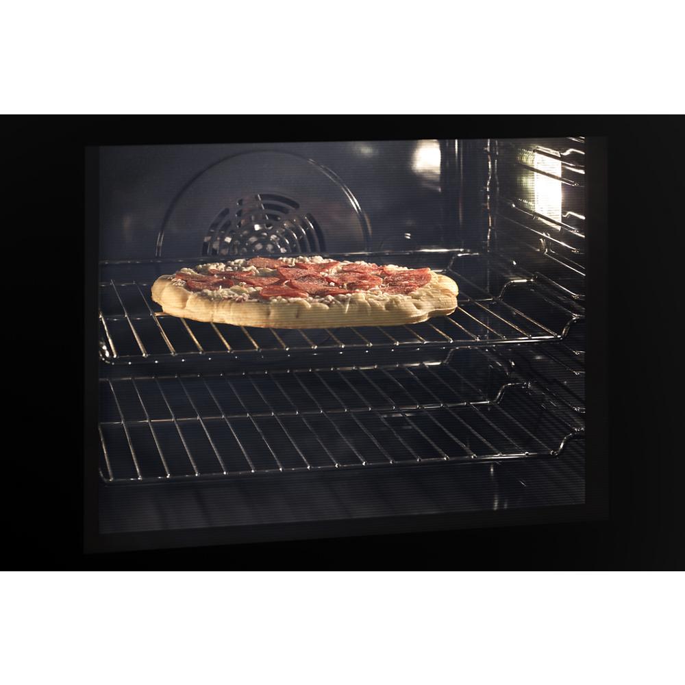Homemade pizza baking inside a 24 inch double wall oven with convection from kitchen appliances collection