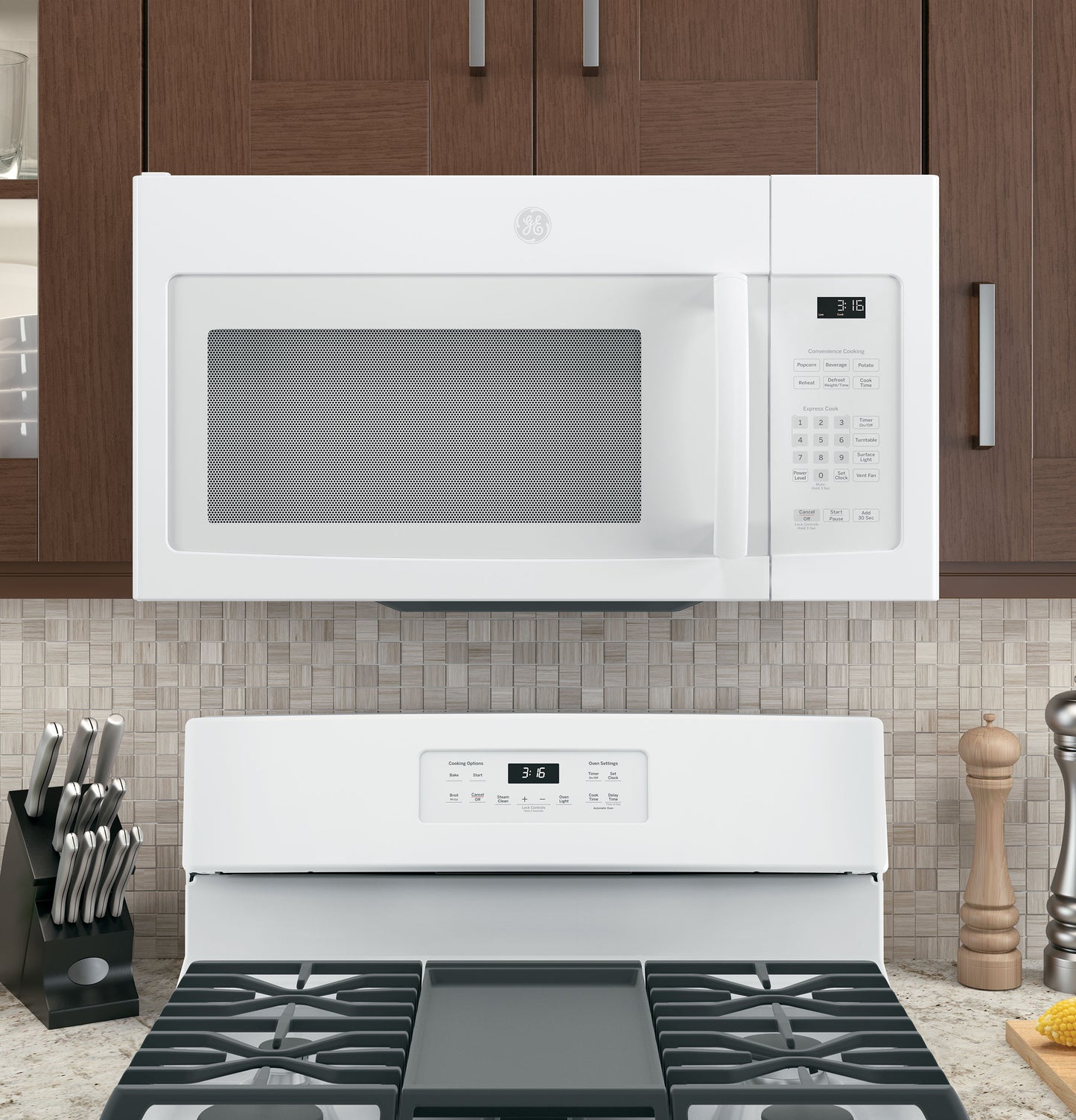White over-the-range microwave with digital control panel installed above stove in modern kitchen setting