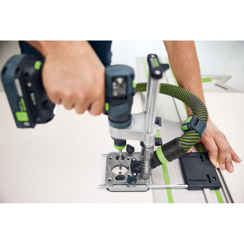 Person using cordless drill with Festool 577971 MB-40 drilling attachment for precise tool accessory drilling tasks