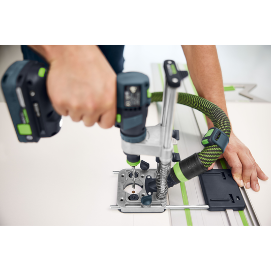 Person using cordless drill with Festool 577971 MB-40 drilling attachment for precise tool accessory drilling tasks