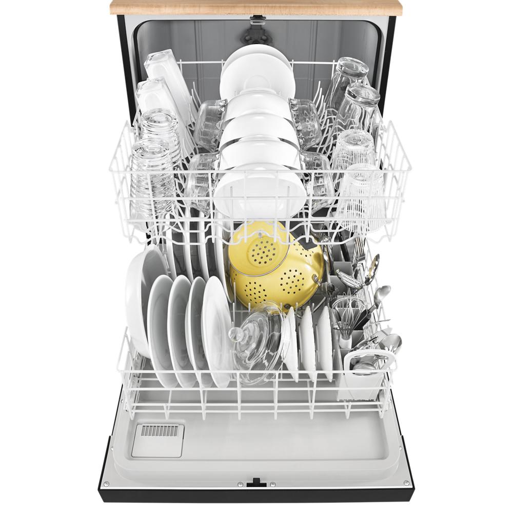 Open dishwasher filled with assorted clean white dishes, glassware, and utensils from kitchenware collection