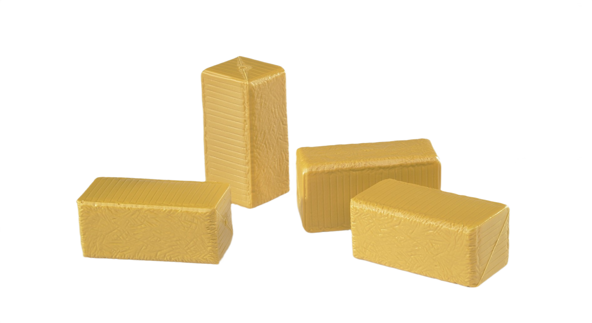 Four tan miniature hay bales in varied positions for model farming or display purposes