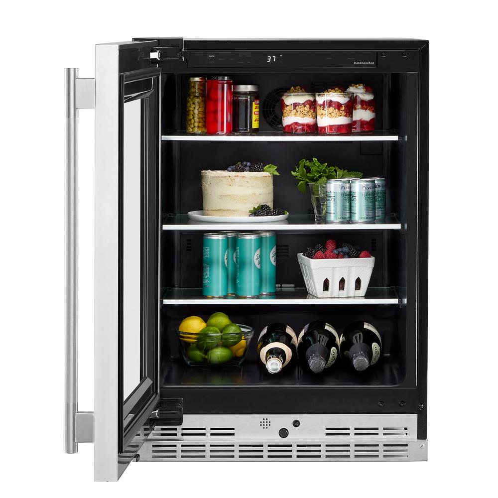 24-inch undercounter refrigerator with glass shelves and metallic accents, ideal for kitchen and bar storage