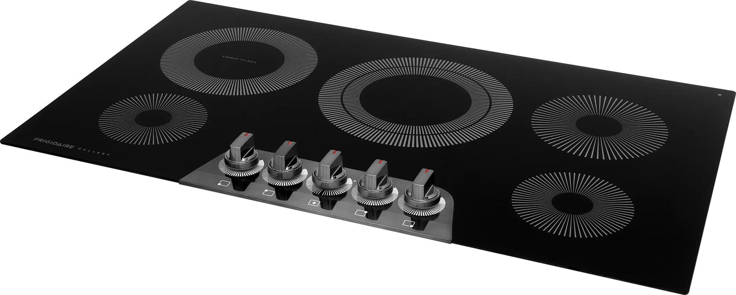 36-inch black electric cooktop with five burners and front stainless steel control knobs in kitchen appliances collection