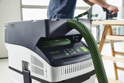 Cordless mobile dust extractor with HEPA filtration, green hose, and digital control panel for home improvement tasks