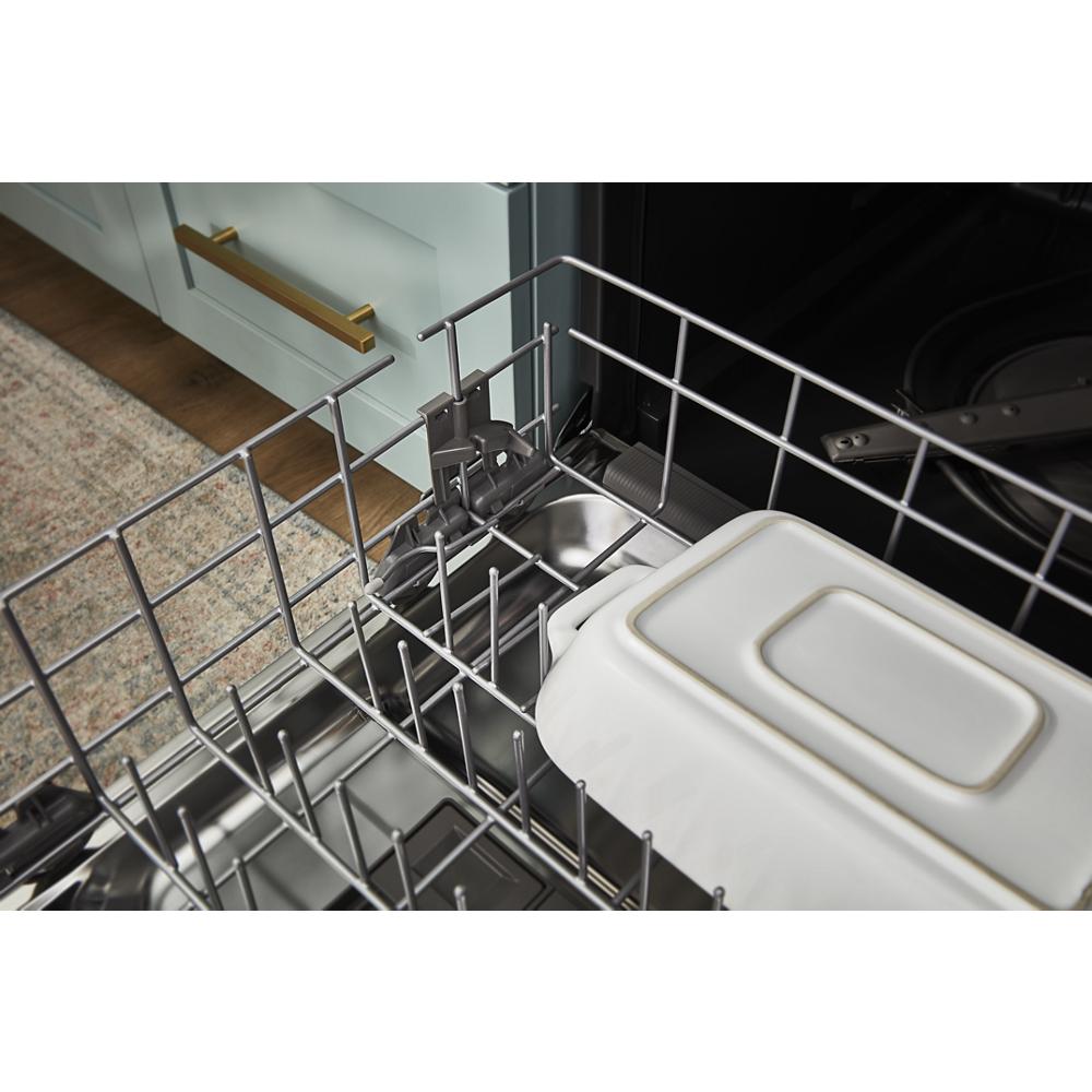 Close-up of an empty dishwasher third rack with a white rectangular dish in a modern kitchen appliance setting