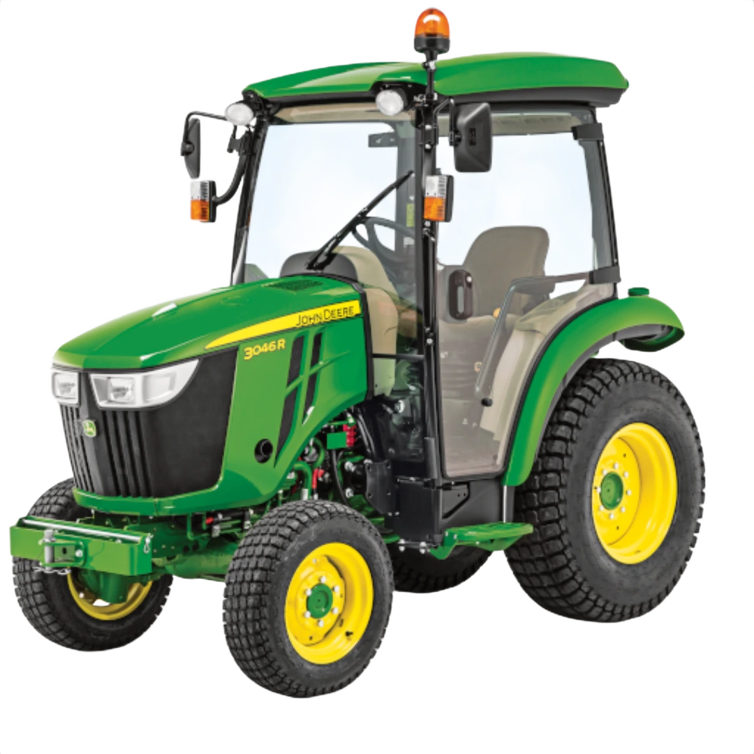 Green John Deere compact tractor with fully enclosed ComfortGard cab, rugged tires, and yellow wheels, featured in Outdoor Power Equipment at Hartville Hardware.