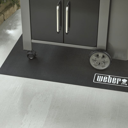 Black floor mat with Weber logo for protecting outdoor grilling areas, ideal for outdoor living and grilling accessories.