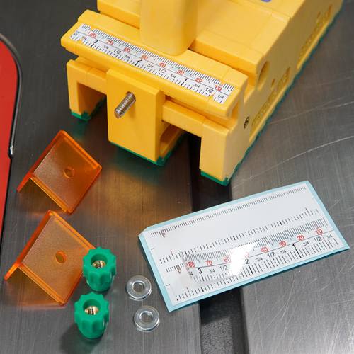 Yellow and green saw accessory kit with measuring scale and transparent orange safety covers for tool accessories collections