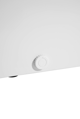 Close-up of white temperature control dial on appliance, part of chest freezer in kitchen and home appliance setting