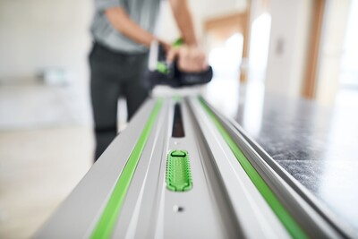 Close-up of aluminum guide rail with green adhesive pads for woodworking tool accessories in home improvement under $50 collection
