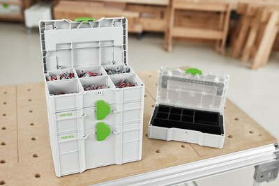 Compact Festool MINI Systainer3 storage boxes with green latches for organizing small parts and workshop accessories