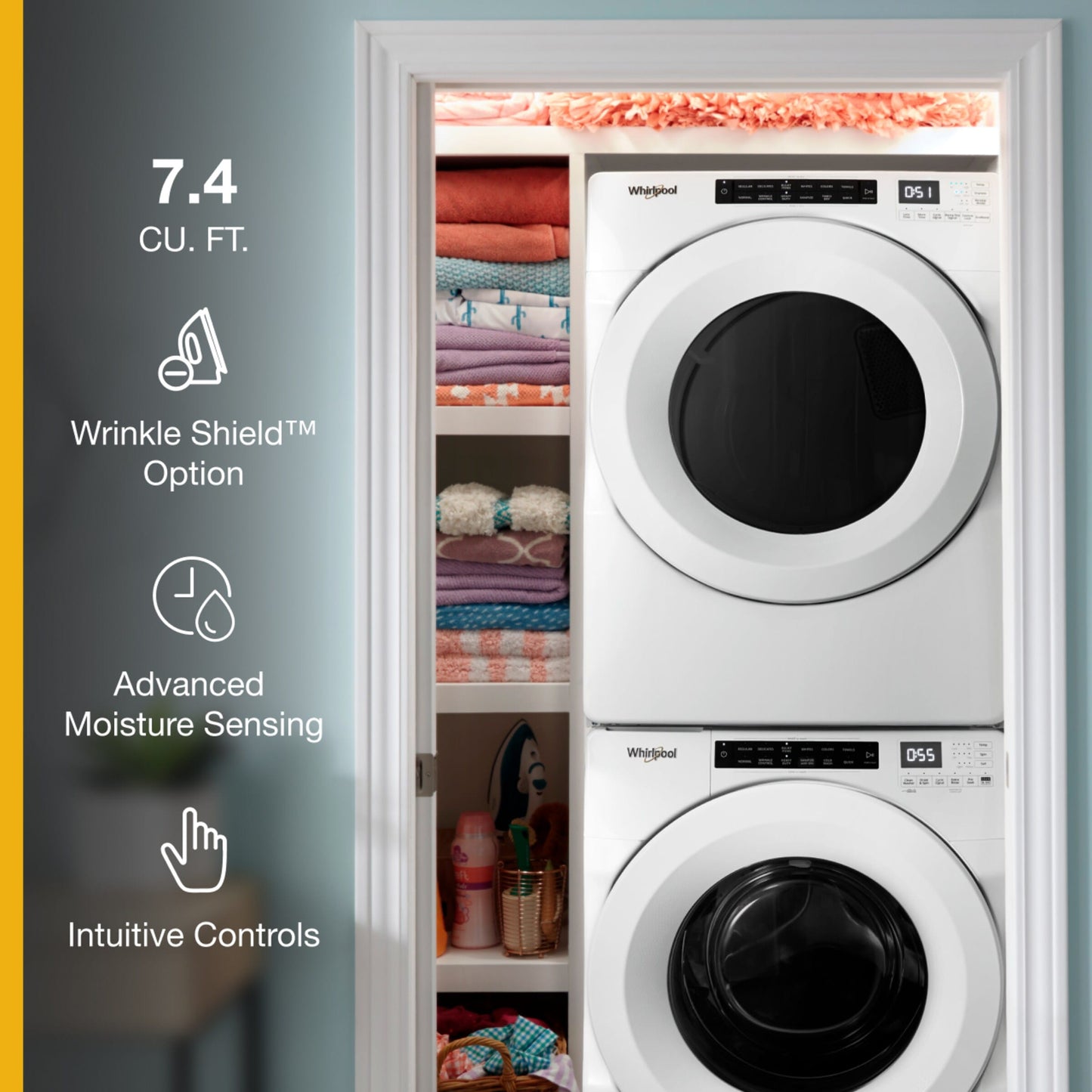 Stacked white electric washer and dryer with digital intuitive controls shown in laundry room for home improvement and appliances.
