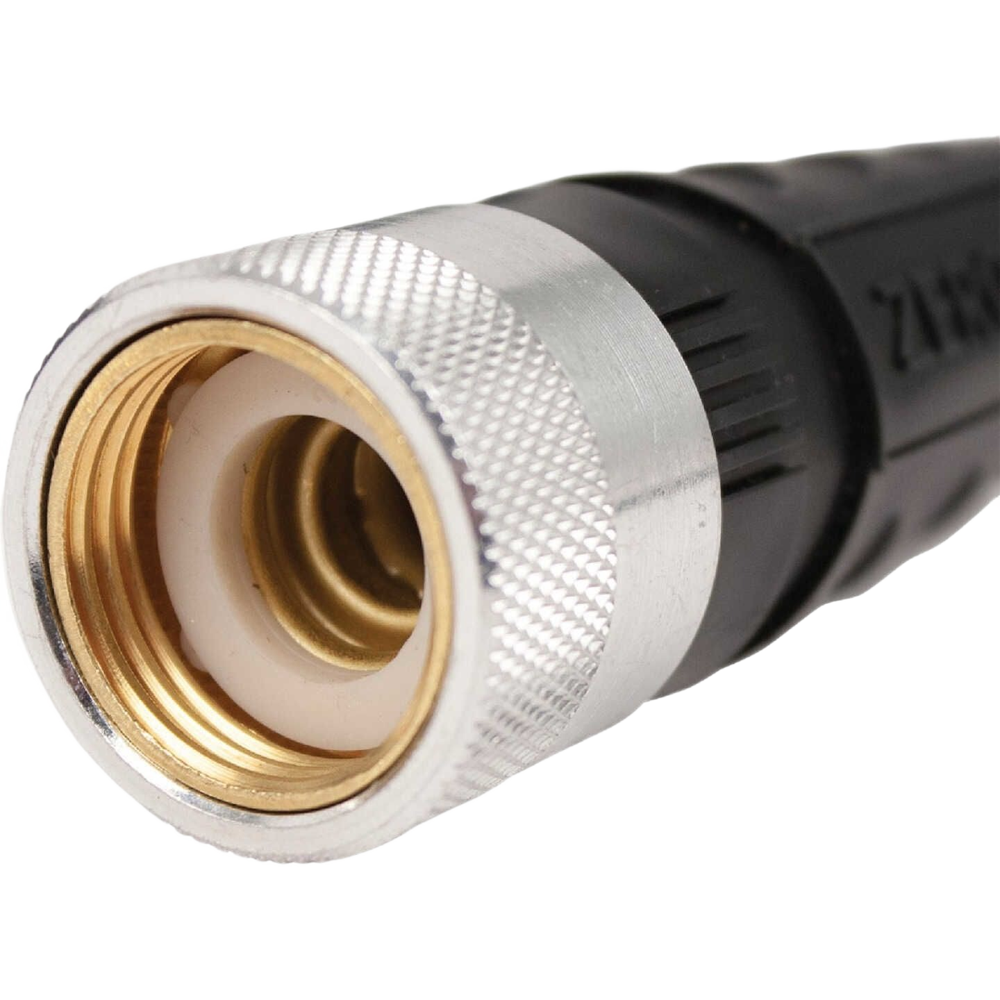 Close-up of brass and silver fitting on black garden hose for watering and irrigation in lawn and garden use under $100 category