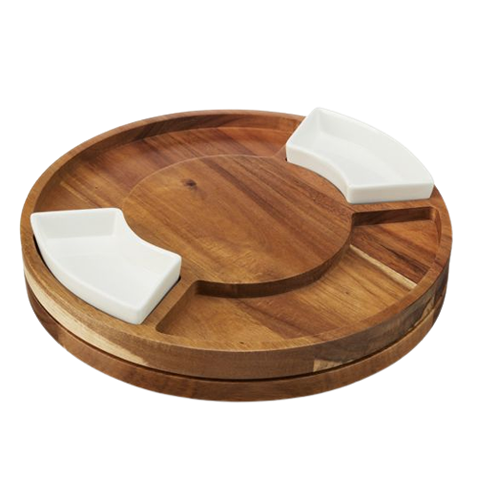 Round wooden rotating board with two white ceramic dishes for serving appetizers and snacks