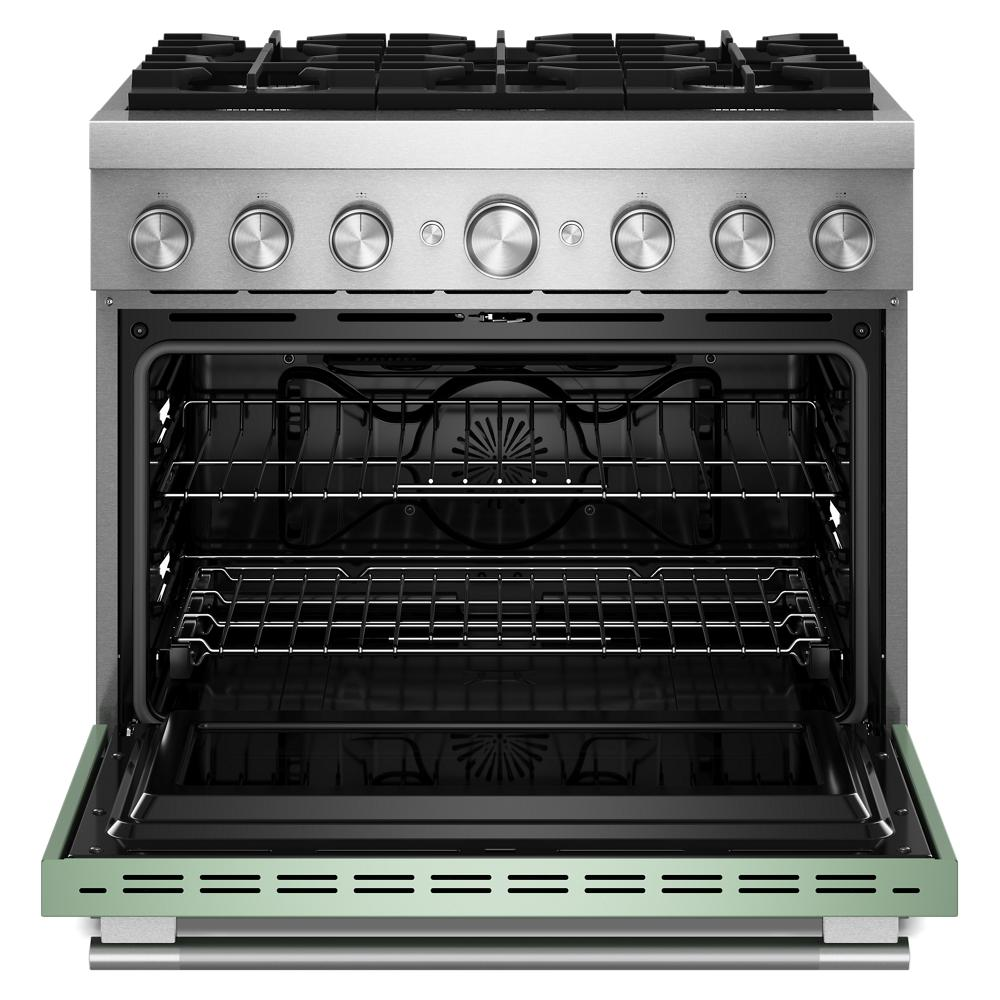 Open stainless steel commercial dual fuel range with six burners and spacious oven interior in kitchenware collection