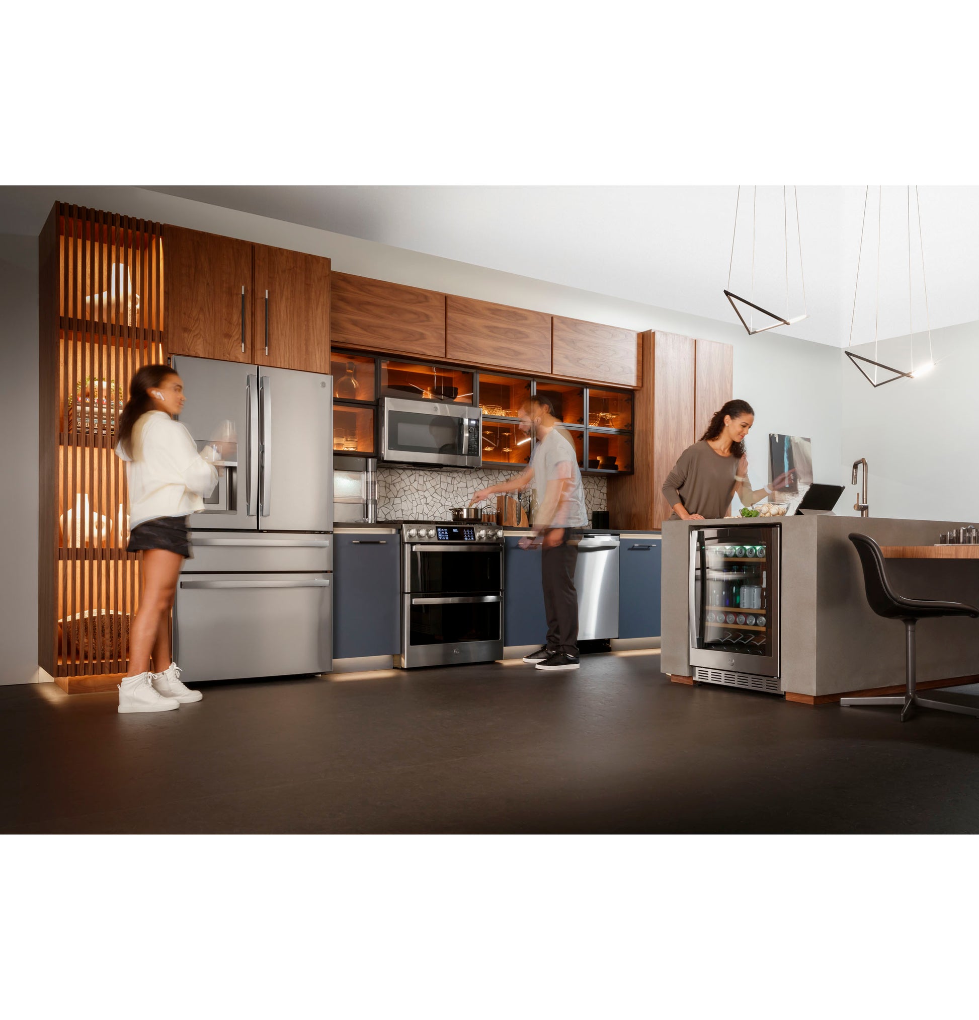 Modern kitchen with fingerprint resistant stainless steel slide-in gas double oven range and matching appliances