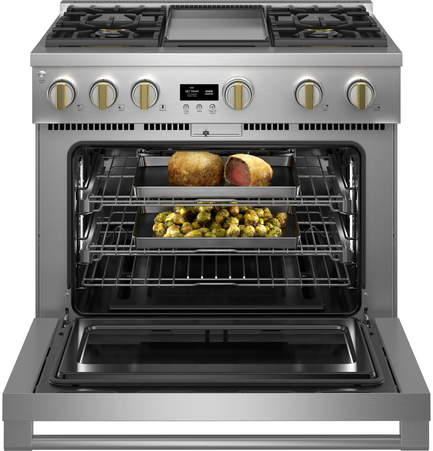 Stainless steel gas range with griddle and open oven showing cooked meat and roasted vegetables in kitchen appliance setting
