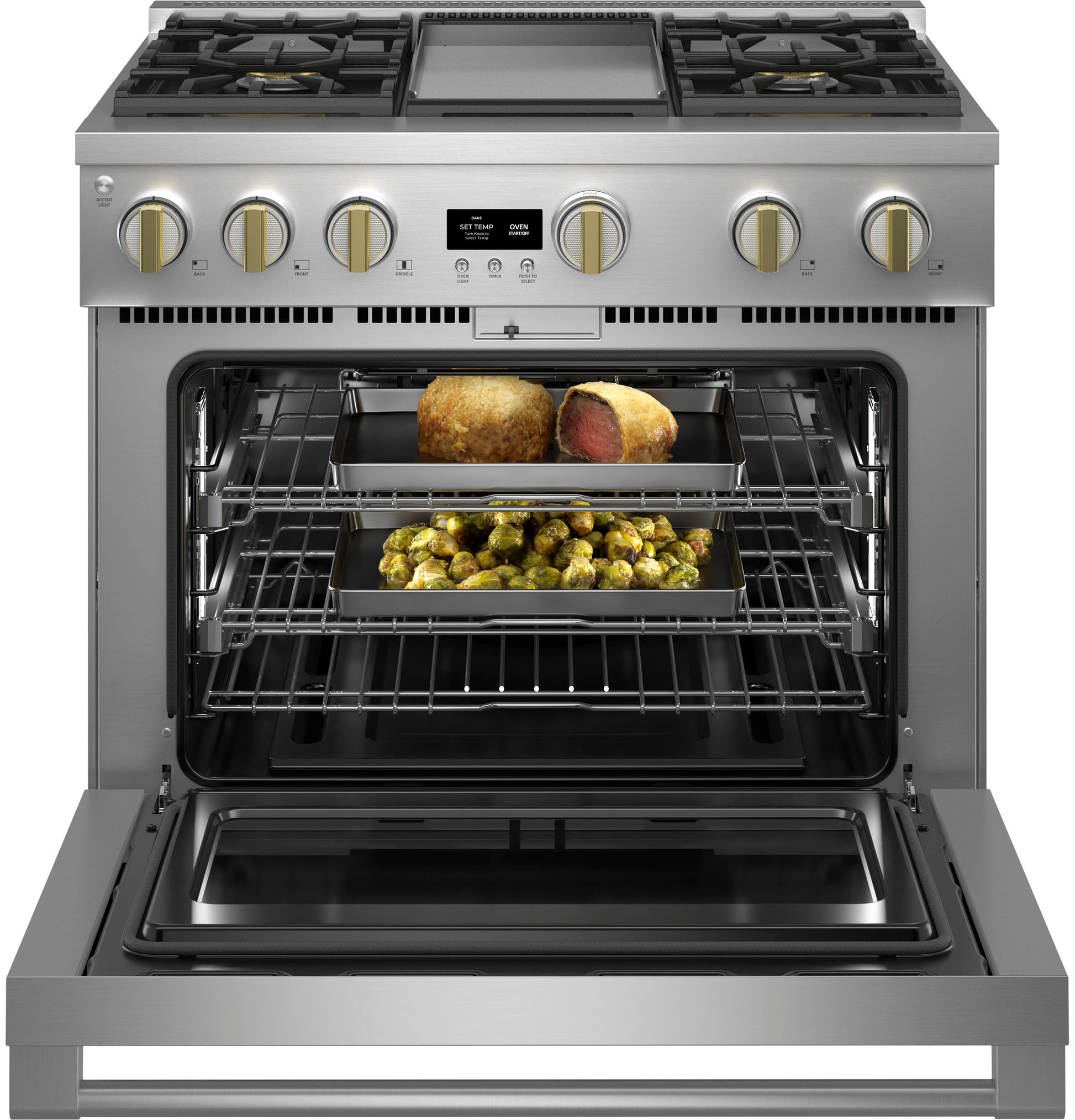Stainless steel gas range with griddle and open oven showing cooked meat and roasted vegetables in kitchen appliance setting