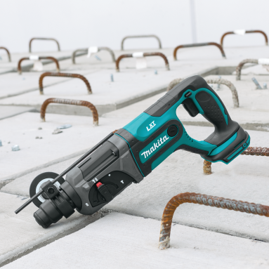 Cordless rotary hammer drill in teal and black designed for home improvement and construction tasks with SDS-Plus bit system