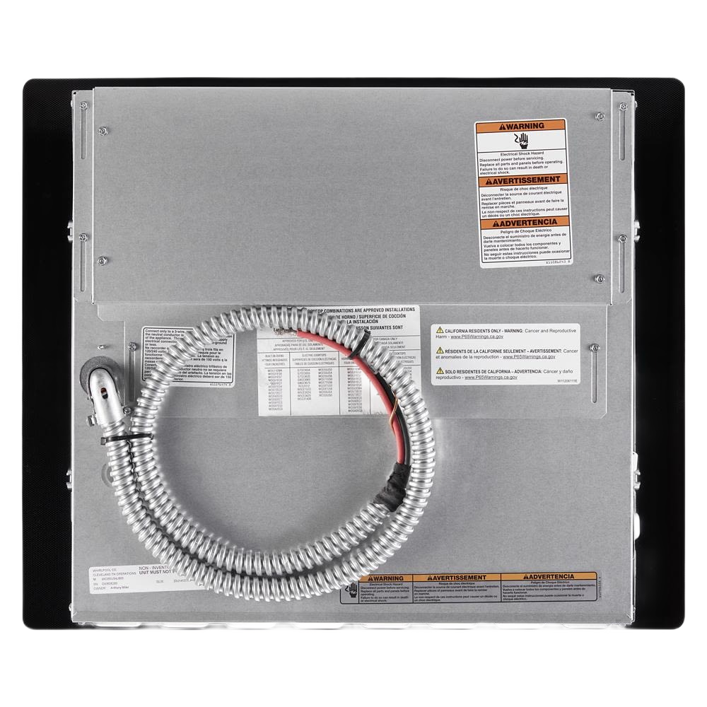 Rear view of stainless steel 24-inch small space induction cooktop with coiled power cord in appliances collection