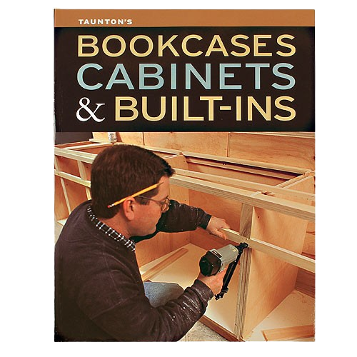 Person assembling wooden cabinetry using a power nailer, illustrating home improvement and woodworking techniques.
