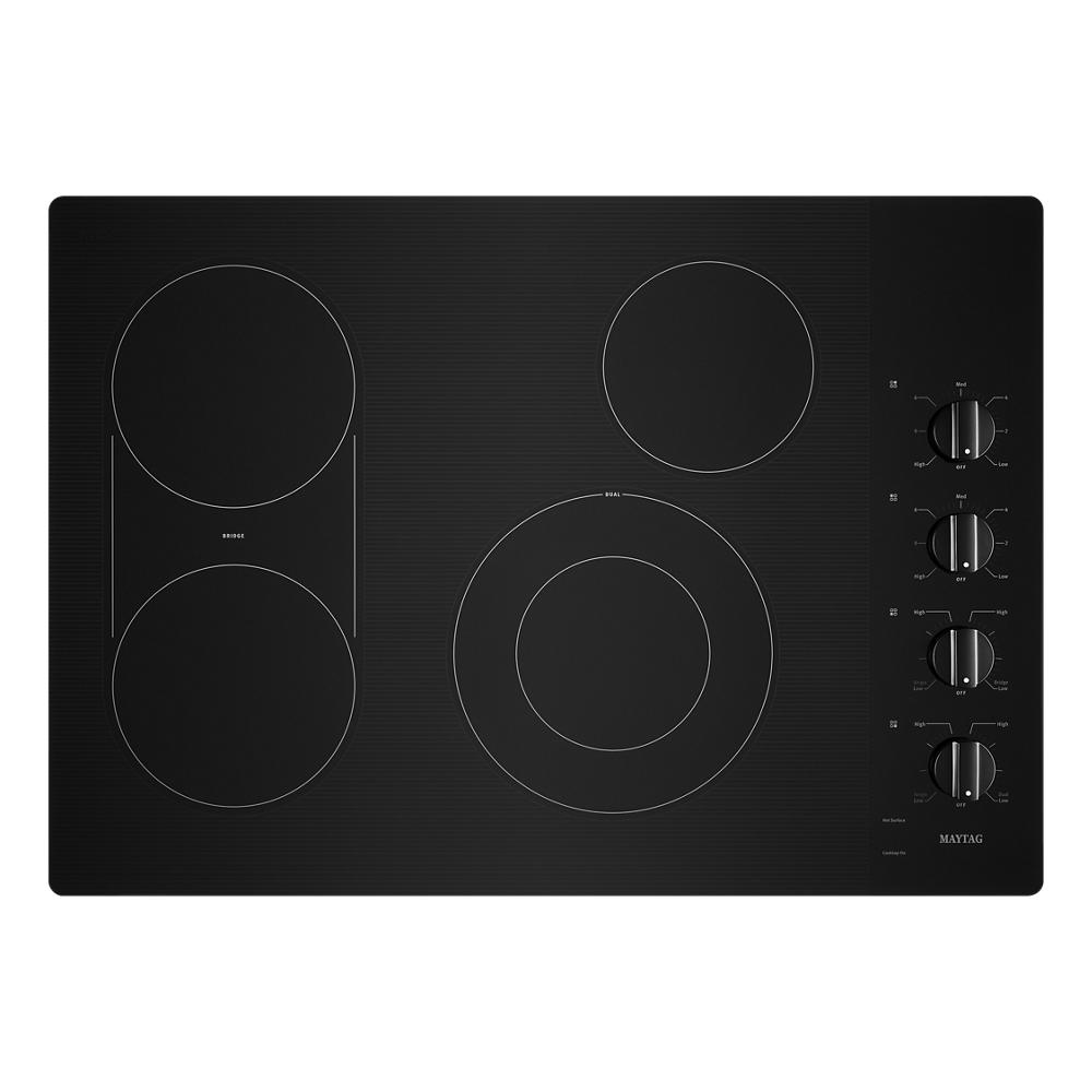 Black electric cooktop with four cooking elements and rotary control knobs from kitchen appliances collection