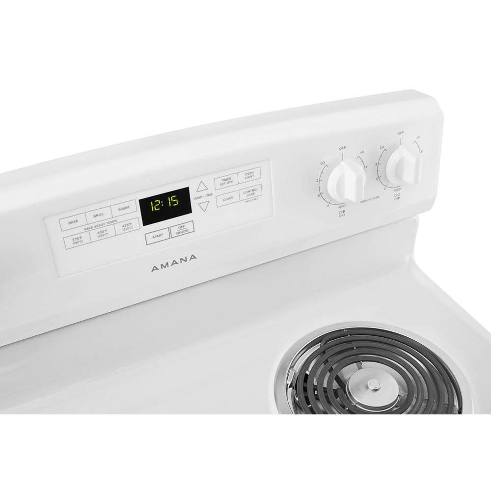 Close-up of white electric range control panel with digital clock and two burner control knobs in appliances collection