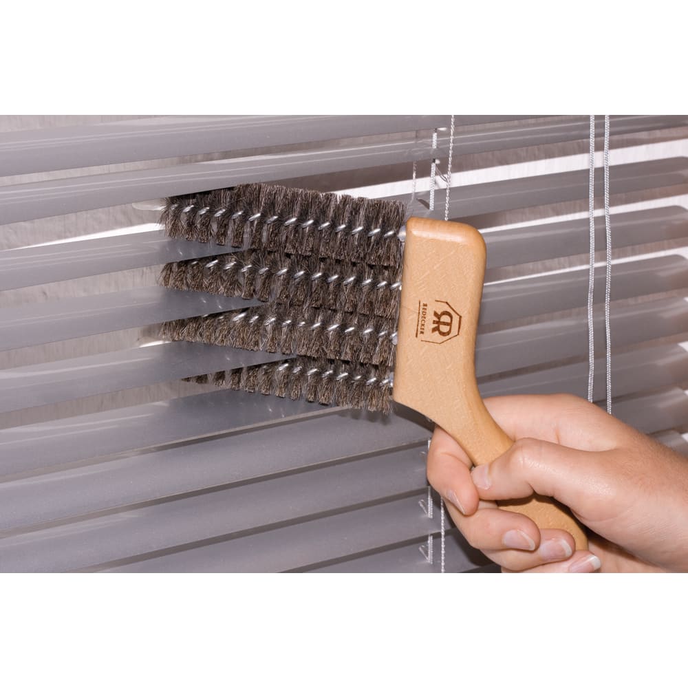 Wood-handled brush with dense bristles cleaning window blinds in Cleaning and Cleaning Tools collections