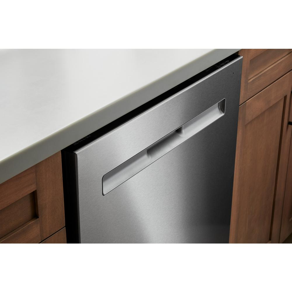 Built-in stainless steel dishwasher with top handle integrated into wood cabinetry in kitchen appliances category