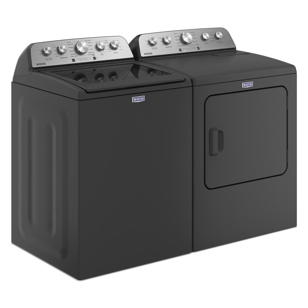 Side view of matching black top load washer and electric dryer with stainless steel control panels in Washers & Dryers collection