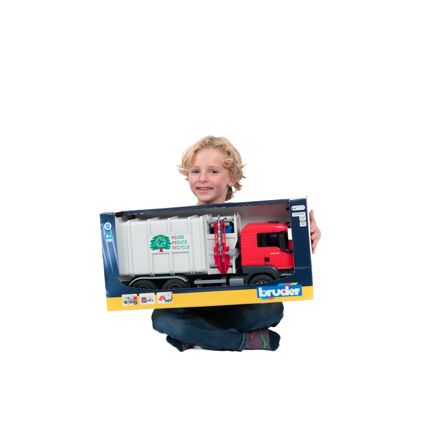 Child holding boxed Bruder red and white side loading garbage truck toy from Vehicles & Remote Controlled Toys collection