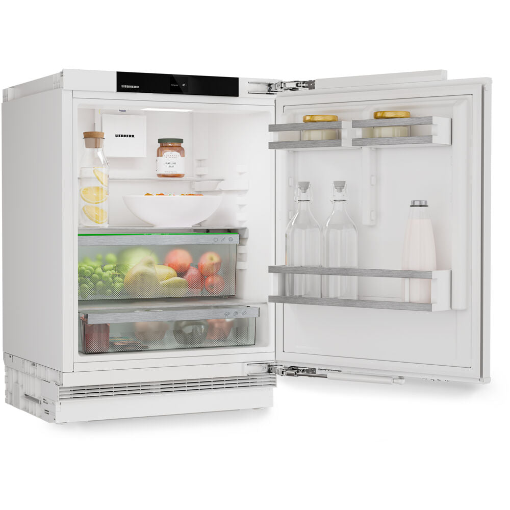 Open view of a white undercounter refrigerator with standard height and right hinge, showing clear storage bins filled with fruits and vegetables, glass bottles, and kitchenware, featured in Refrigerators and Kitchen & Kitchenware collections.