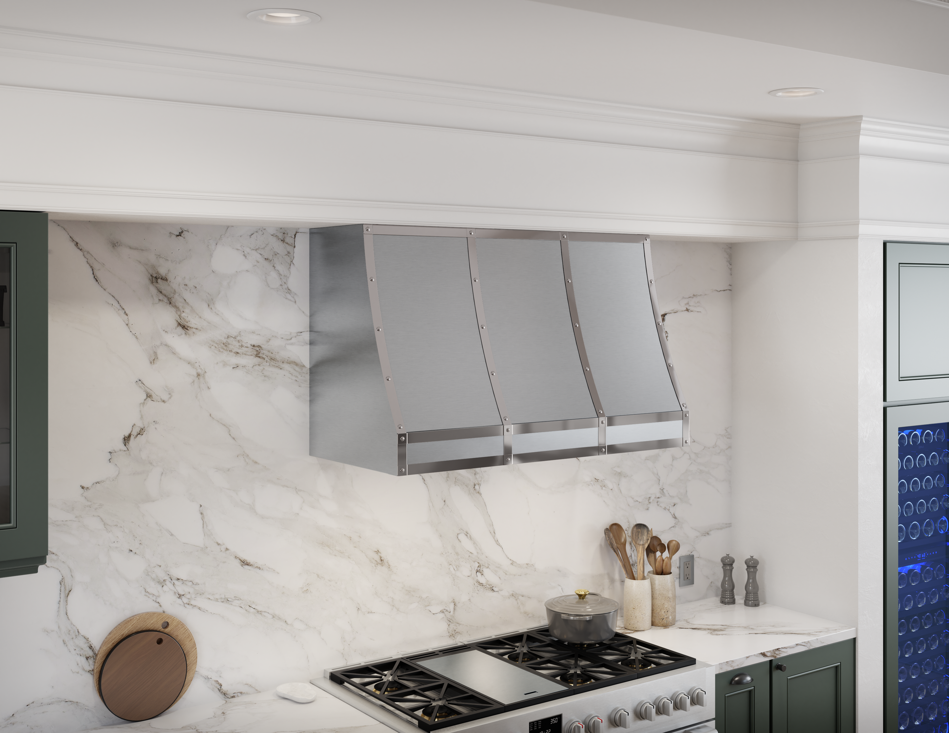 Stainless steel custom wall mounted hood with polished banding above gas range in modern kitchen setting with marble backsplash