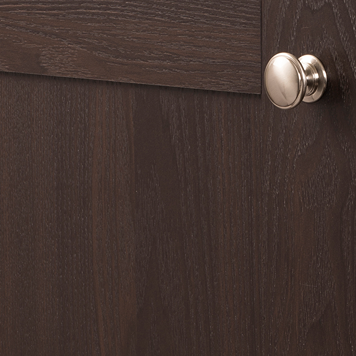 Satin nickel cabinet knob with classic Williamsburg design mounted on dark wood cabinet for home improvement projects