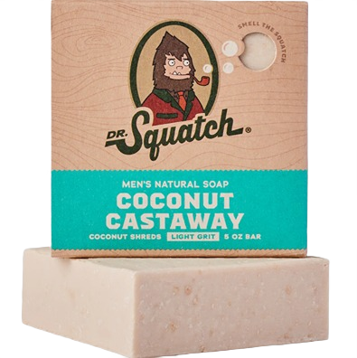 Natural soap bar with coconut shreds in light grit texture, packaged in branded cardboard box for men's grooming.