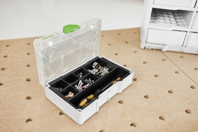 Compact Festool storage box with clear lid and green latch for organizing small parts and workshop accessories