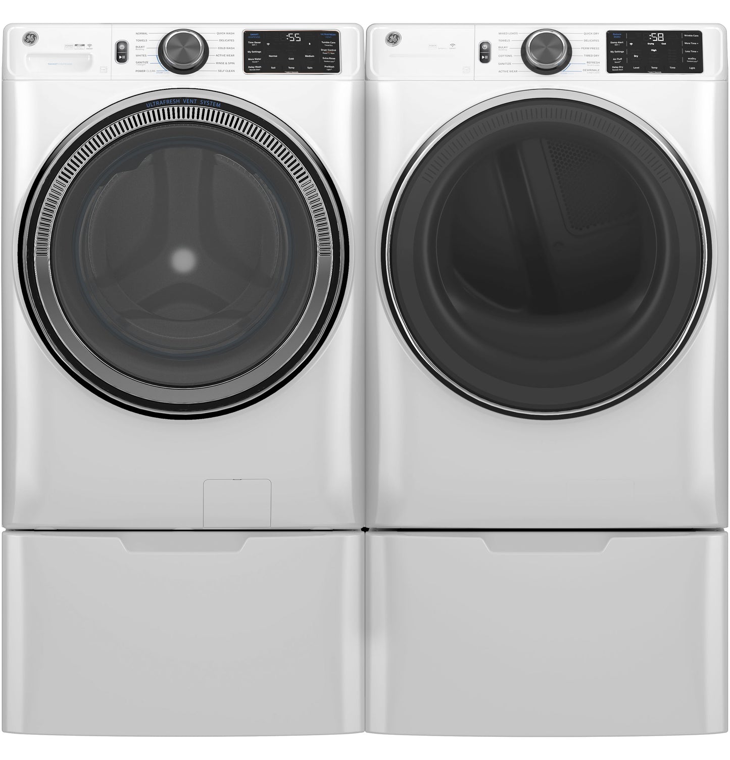 Pair of white front load washers and dryers with digital controls and pedestal drawers in appliances collection