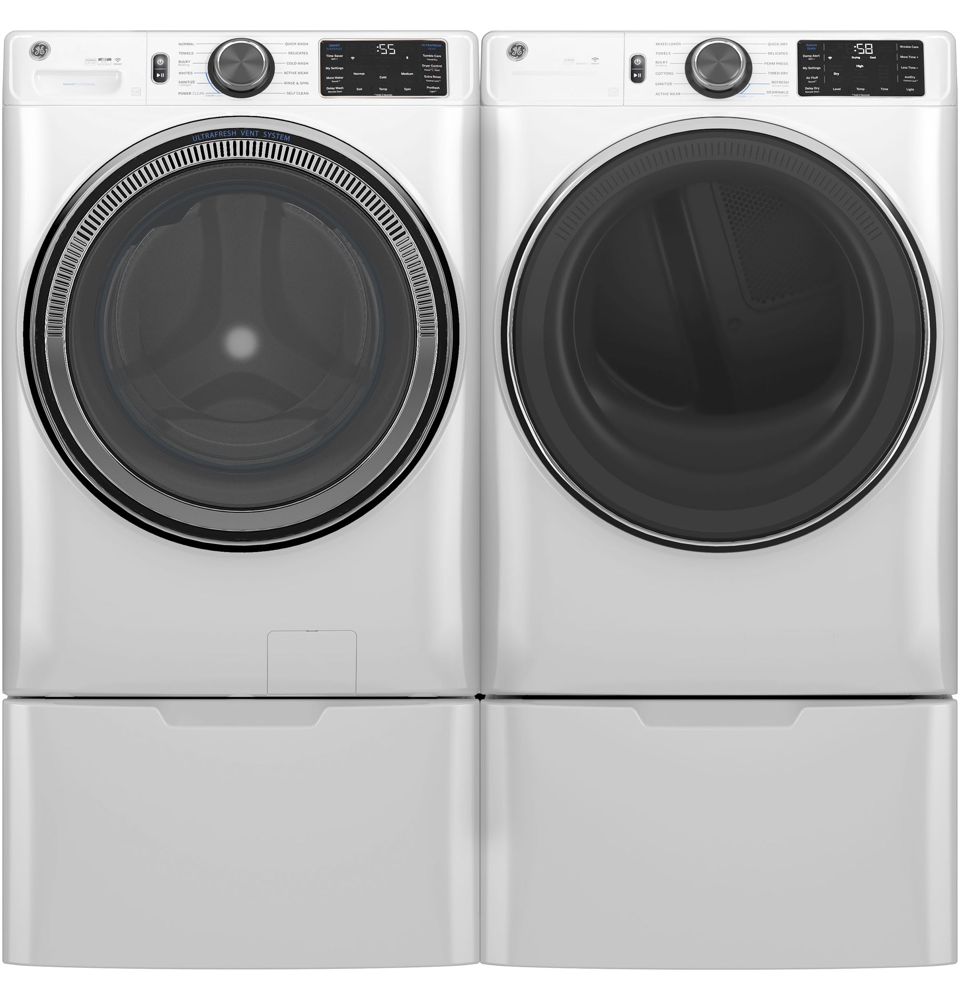Pair of white front load washers and dryers with digital controls and pedestal drawers in appliances collection
