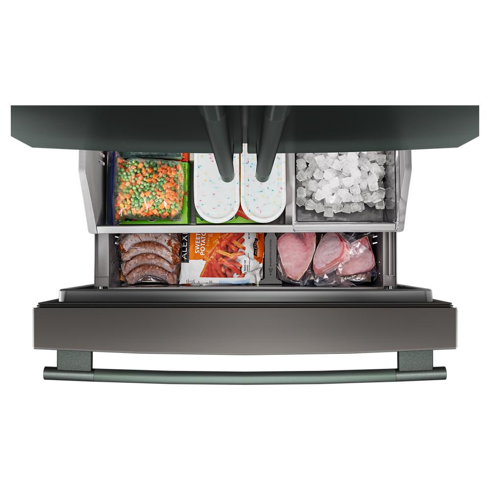 Open bottom freezer drawer of counter-depth French door refrigerator showing organized frozen food compartments and ice bin