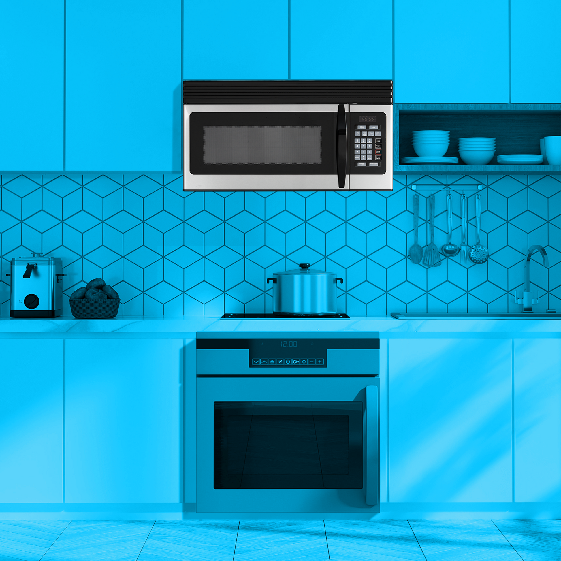 Stainless steel over-the-range microwave with digital keypad and black handle above built-in oven in modern kitchen setting