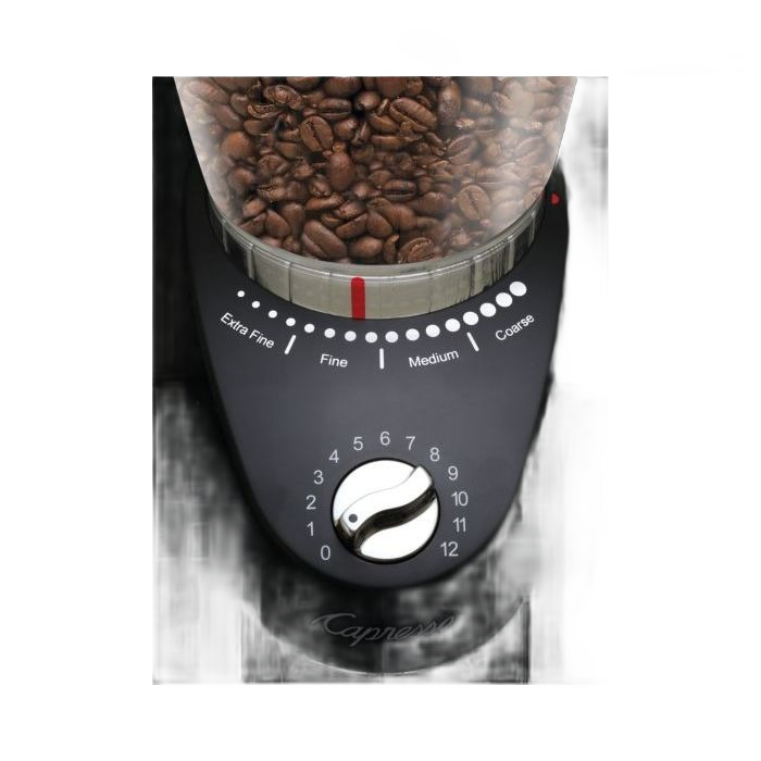 Close-up of black coffee grinder with conical burr settings and transparent bean hopper filled with coffee beans