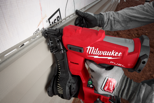 Red Milwaukee M18 FUEL coil roofing nailer with vinyl siding tip in use on siding tools for home improvement