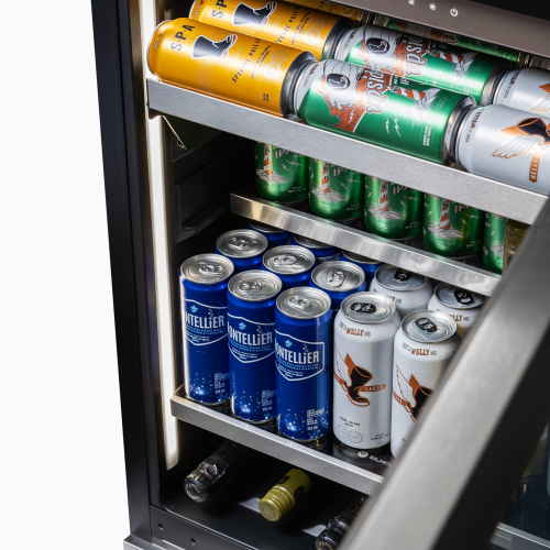 Compact stainless steel beverage centre with glass door, adjustable shelves, and LED lighting in kitchen appliances collection