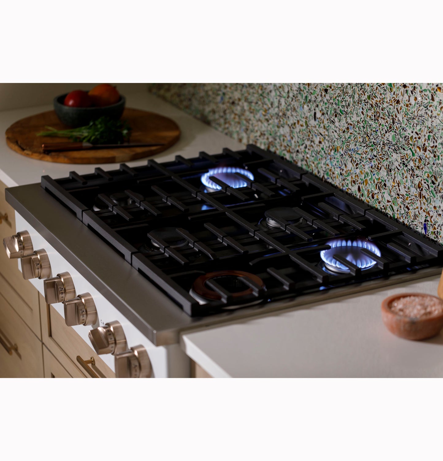 Stainless steel 36-inch commercial-style gas rangetop with six burners, three ignited, in kitchen appliances collection