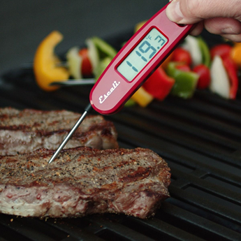 Red compact folding digital thermometer measuring steak temperature for kitchen gadgets and cookware under $50 collections