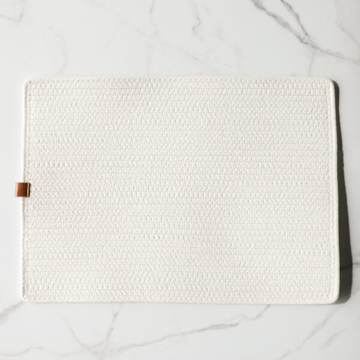Ivory rectangular placemat with textured fabric surface on marble table in kitchen and tableware collection