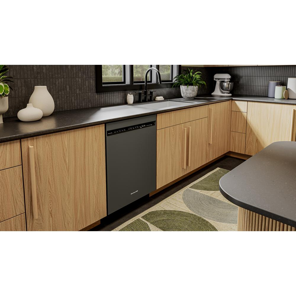 Built-in black dishwasher integrated into modern kitchen cabinetry with wood finish and dark countertops