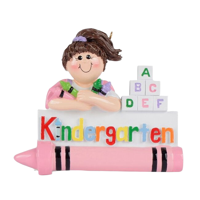 Smiling girl with brown hair holding crayon behind colorful Kindergarten sign and alphabet blocks ornament under $50